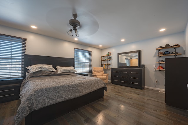 bedroom with ceiling fan and dark hardwood / wood-style flooring