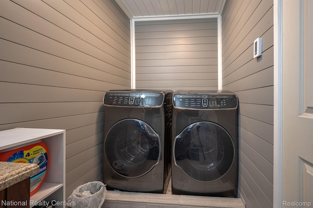 10040 Old Farm Trl, Davisburg, MI 48350 - washroom featuring washing machine and clothes dryer and wooden walls