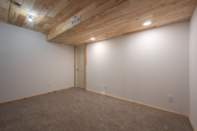 basement featuring carpet and wooden ceiling