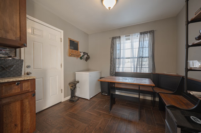 interior space featuring dark parquet flooring