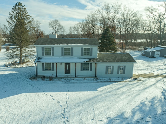 view of front of property featuring an outdoor structure