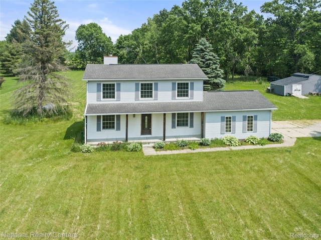10040 Old Farm Trl, Davisburg, MI 48350 - view of front of home featuring covered porch, a chimney, a front yard, and a shingled roof