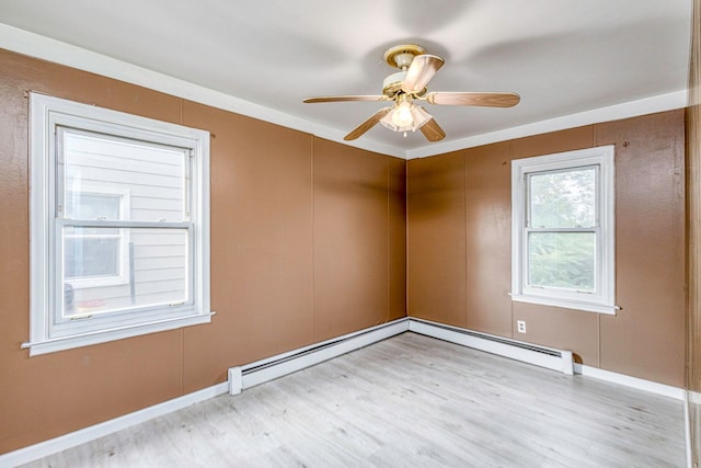 unfurnished room featuring light hardwood / wood-style floors, ceiling fan, and ornamental molding