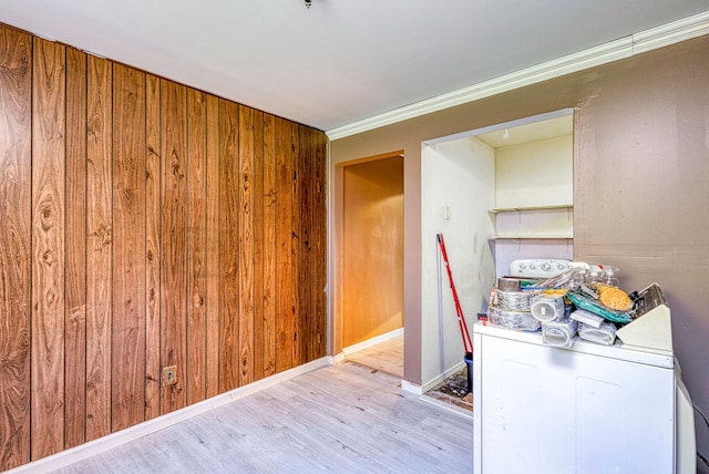 washroom featuring wood walls and light wood-type flooring