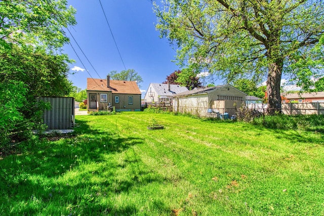 view of yard with an outdoor fire pit