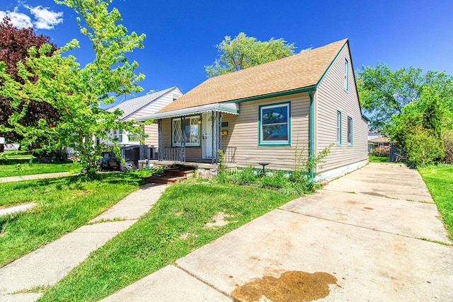 bungalow-style house featuring a front yard