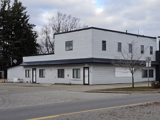 view of front of property featuring central AC unit