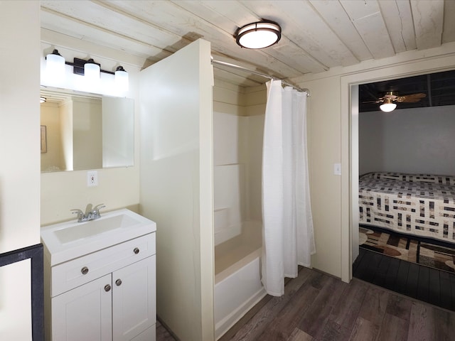 bathroom with vanity, ceiling fan, shower / bath combo with shower curtain, hardwood / wood-style flooring, and wooden ceiling