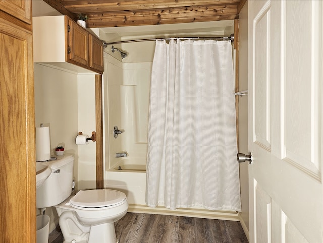 bathroom featuring beamed ceiling, toilet, wood-type flooring, and shower / tub combo with curtain