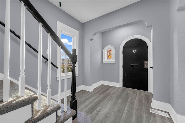 16148 Roselawn St, Detroit, MI 48221 - foyer entrance with arched walkways, wood finished floors, and stairs
