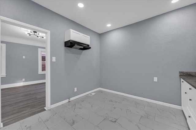 16148 Roselawn St, Detroit, MI 48221 - unfurnished room featuring marble look tile flooring, recessed lighting, and a chandelier