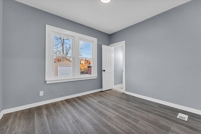 16148 Roselawn St, Detroit, MI 48221 - spare room with dark wood finished floors and baseboards