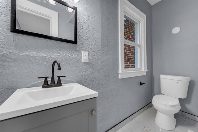 16148 Roselawn St, Detroit, MI 48221 - half bath featuring marble finish flooring, vanity, and a textured wall