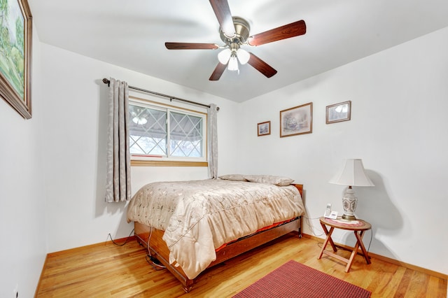 bedroom featuring hardwood / wood-style flooring and ceiling fan