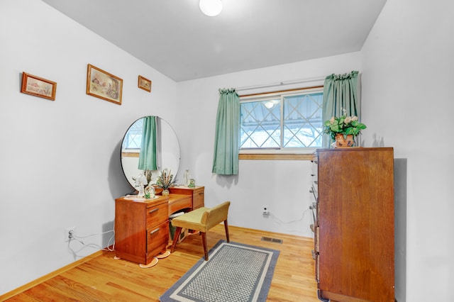 sitting room featuring light hardwood / wood-style flooring