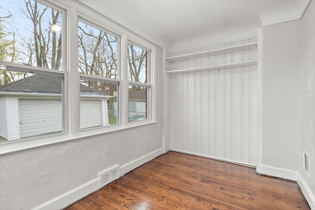 interior space with dark hardwood / wood-style floors