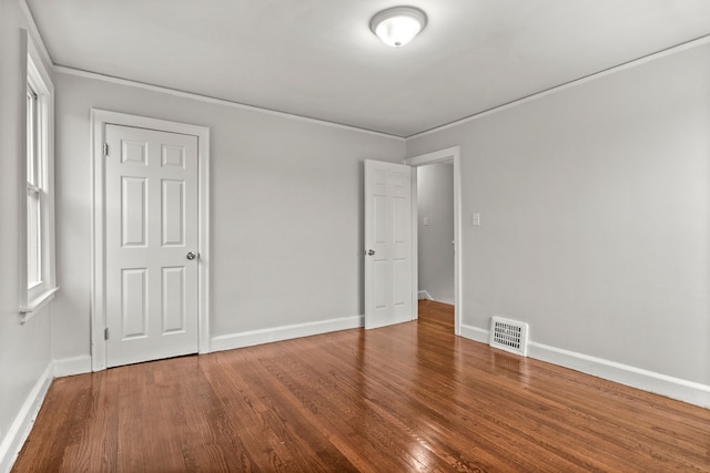 unfurnished bedroom featuring a closet and wood-type flooring