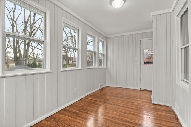 unfurnished sunroom with plenty of natural light