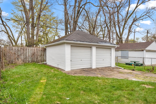 garage featuring a lawn