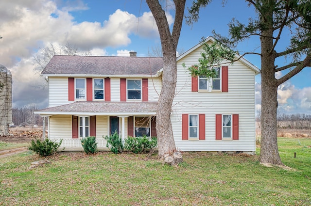 view of front of house with a front lawn and a porch