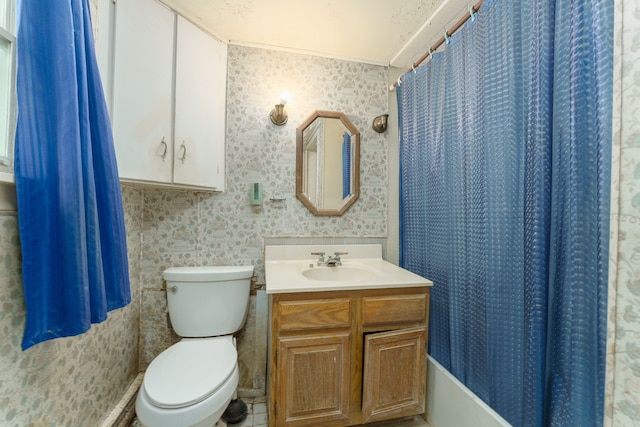 bathroom with vanity, toilet, and walk in shower