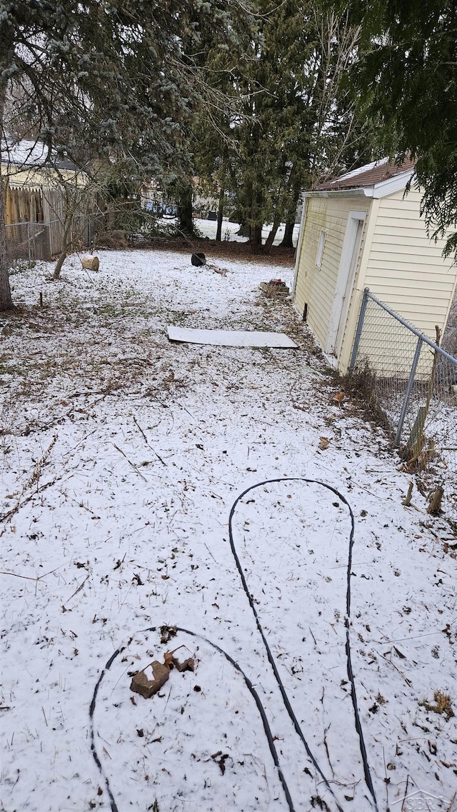 view of yard layered in snow