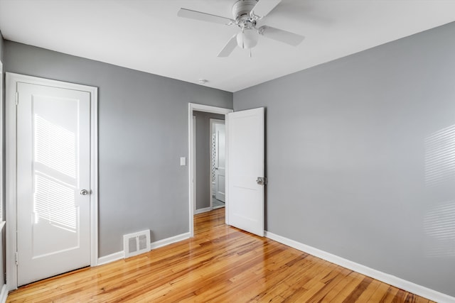 unfurnished bedroom featuring ceiling fan and light wood-type flooring