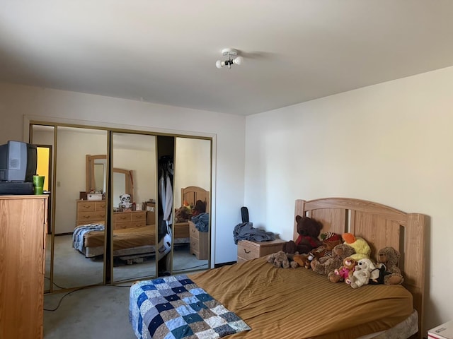 carpeted bedroom featuring a closet