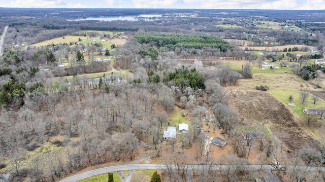 birds eye view of property with a rural view