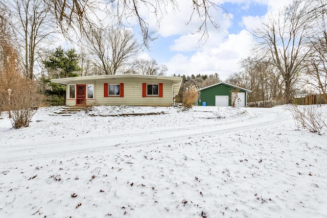 view of front of property featuring an outbuilding and a garage