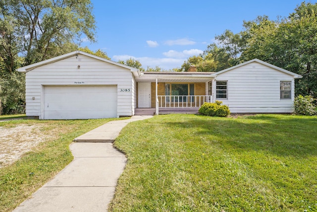 ranch-style house with a porch, a garage, and a front lawn