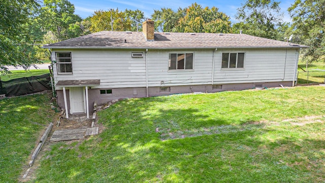 3085 S Center Rd, Burton, MI 48519 - rear view of property featuring a chimney, a lawn, and roof with shingles