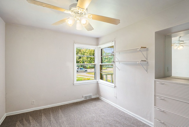 unfurnished room featuring carpet floors and ceiling fan