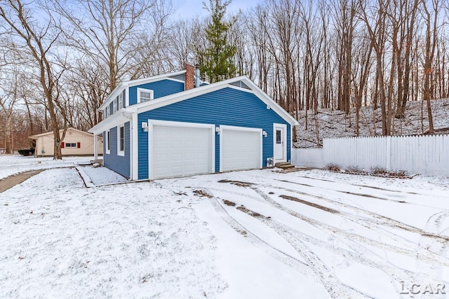 view of snow covered garage