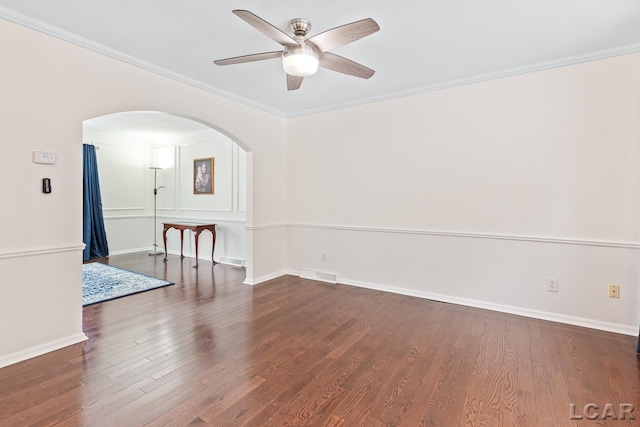 unfurnished room with dark hardwood / wood-style floors, ceiling fan, and crown molding