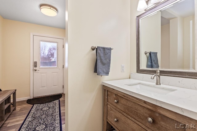 bathroom with vanity and hardwood / wood-style flooring