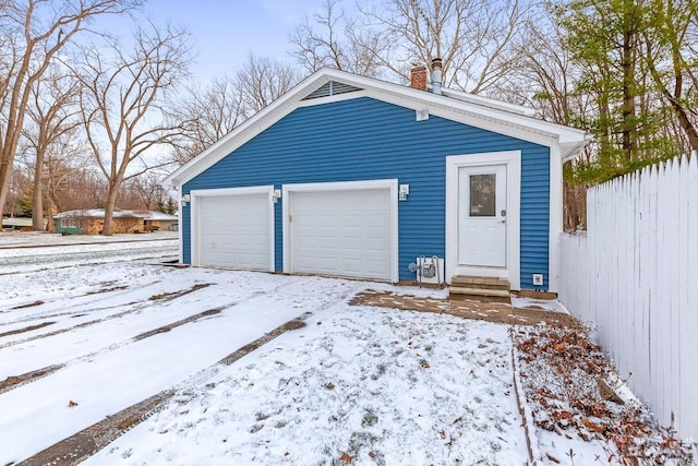 view of snow covered garage