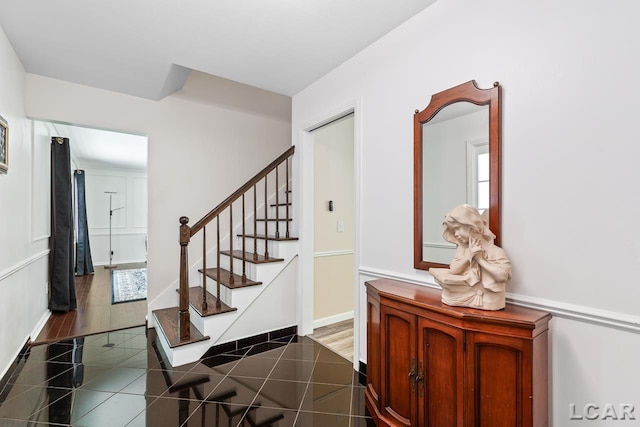 stairs with hardwood / wood-style floors