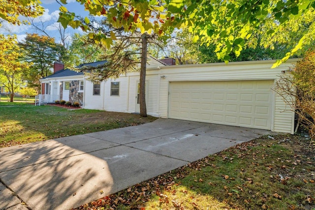 exterior space featuring a front yard and a garage