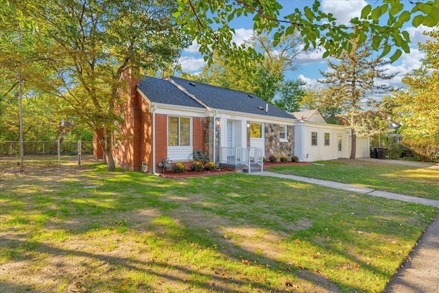 ranch-style house featuring a front lawn