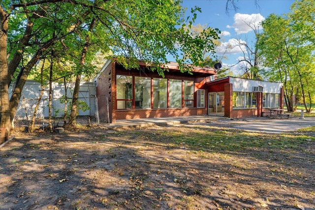 exterior space with a sunroom