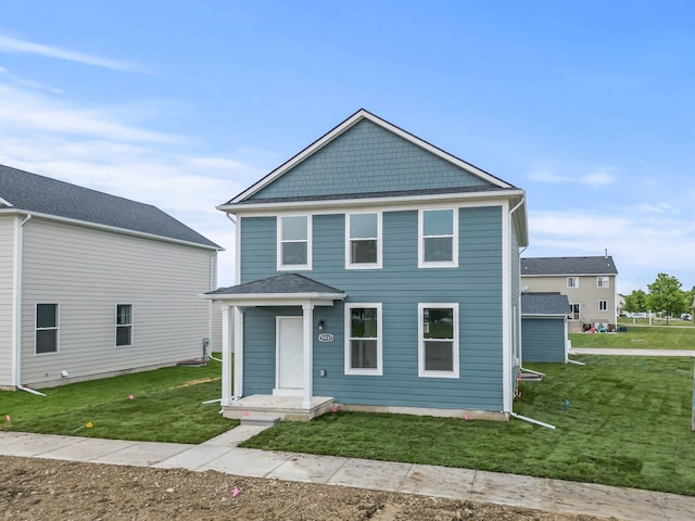 view of front of home with a front lawn