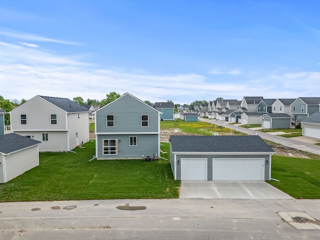 view of front of house with a garage and a front yard