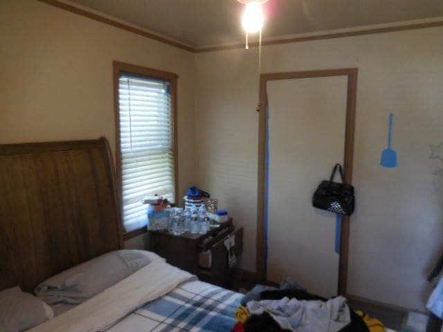 bedroom with ornamental molding