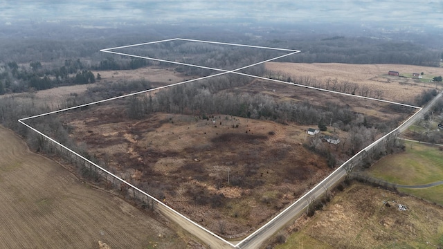 birds eye view of property featuring a rural view