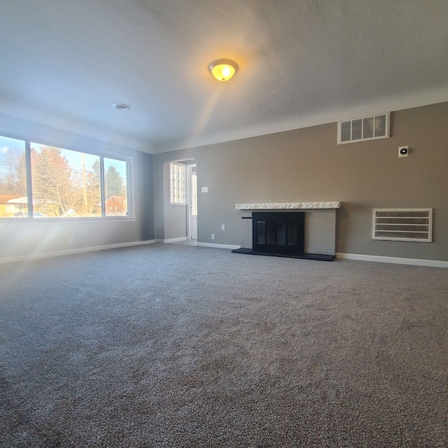 unfurnished living room with carpet