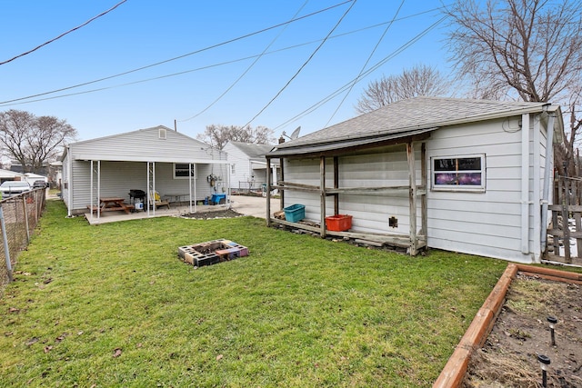 view of yard featuring an outdoor fire pit and a patio area