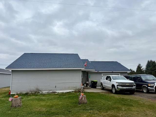 rear view of house with a lawn