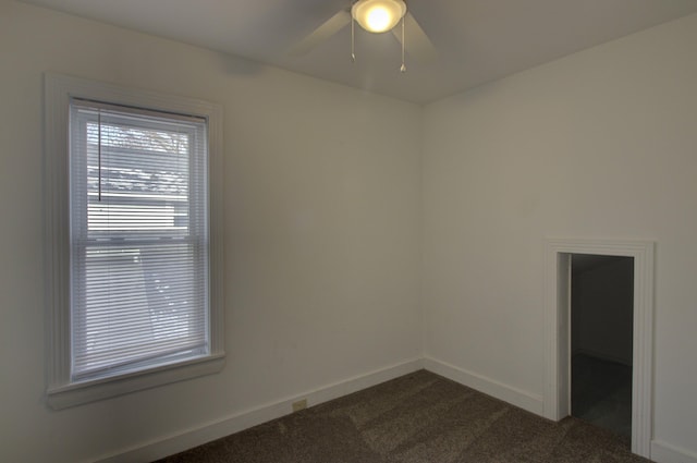 carpeted empty room with ceiling fan