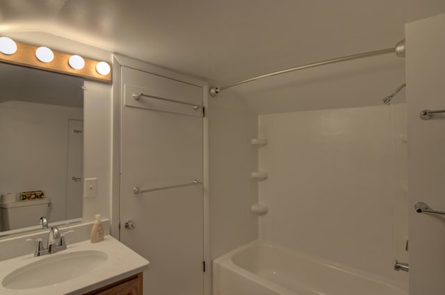 full bathroom featuring vanity,  shower combination, and toilet